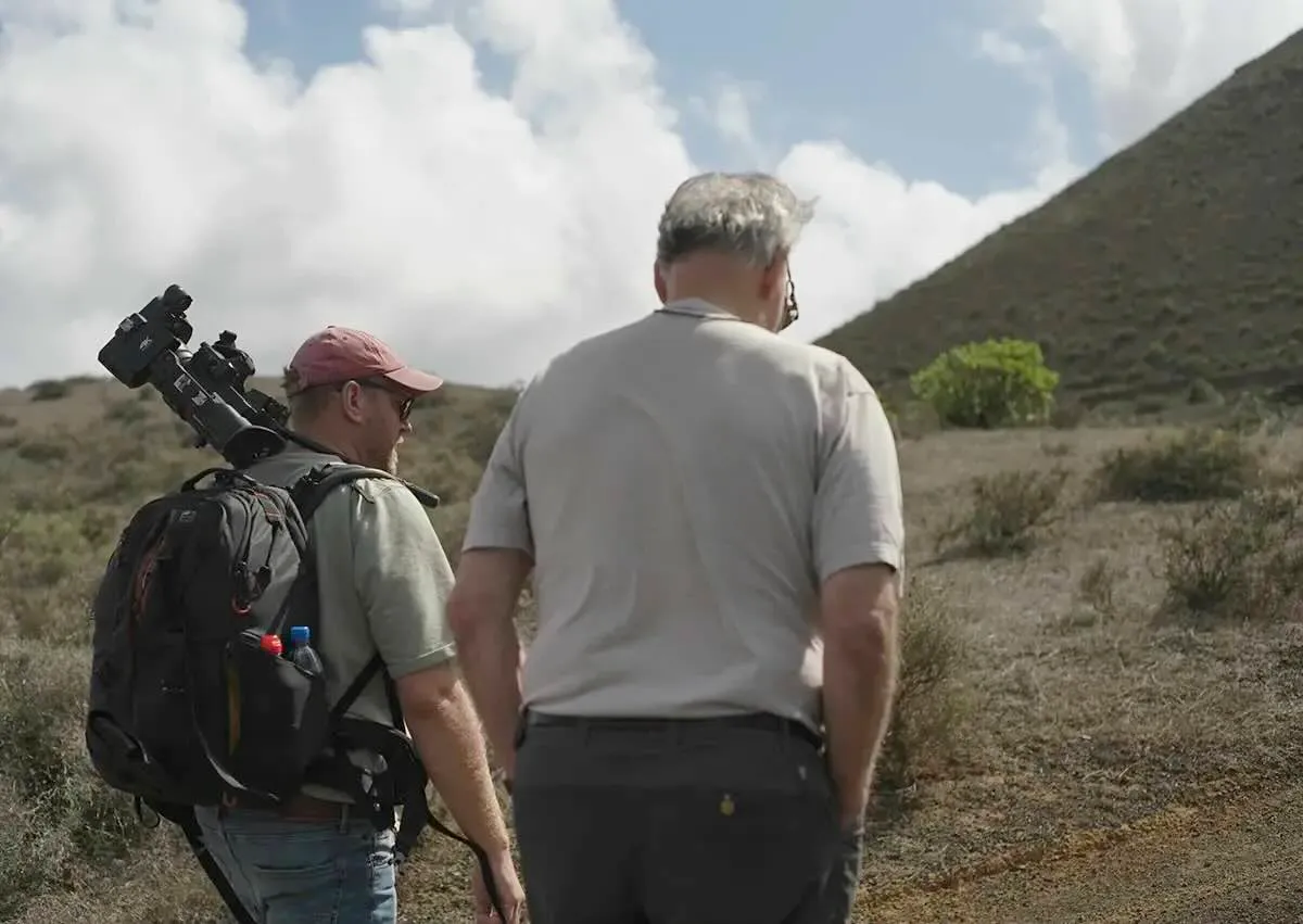 Tim van den Hoff and Werner Herzog scale a volcanic terrain in Lanzarote.